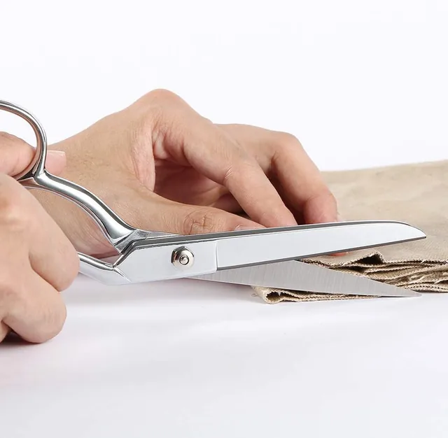 LIVINGO all-steel shears cutting natural fabric on a table