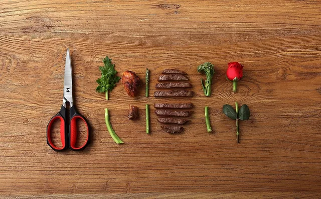Kitchen shears beside neatly arranged ingredients on a wooden board